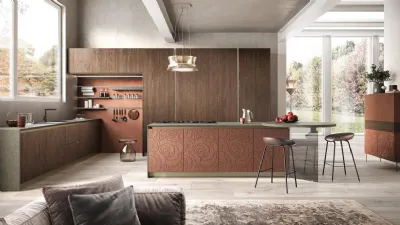 Isola con piano di cottura a induzione e capace tavolo accostato per la cucina College by Moretti Compact Cucine