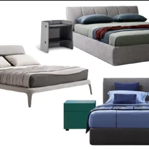 Letto Kelly di Poliform e comodino B1 H64 PERFORATED rosso di Tolix, Letto Warp di Lema e Comodino Parentesi di Bonaldo, Letto Mypace di Flou e comodino verde Swift di Cappellini
