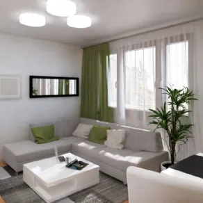 Open space in piccolo appartamento in toni di grigio e verde