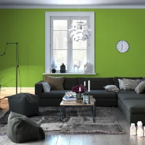 Zona living dal design minimale in verde e grigio