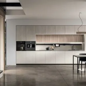 Tosca di Stosa cucine. Cucina con penisola e living integrato