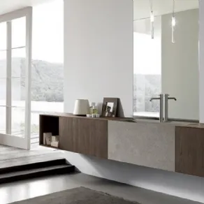 Linea More di Modulnova con mobile in rovere e lavabo in pietra piasentina