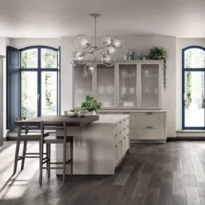 Cucina anta telaio impiallacciato cashmere, isola con piano snack Carattere restyling di Scavolini