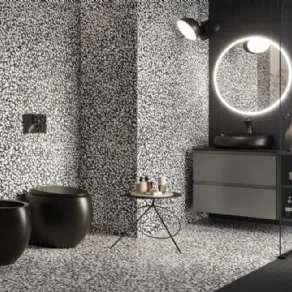 Grès porcellanato effetto graniglia della serie Dark Ink di RAK Ceramics
