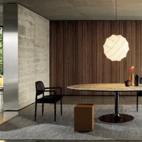 Tavolo Oliver Dining di Minotti Italia con top in marmo e base metallica