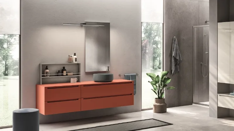 Rosso declinato in arancio salmone per la collezione Idra di Scavolini