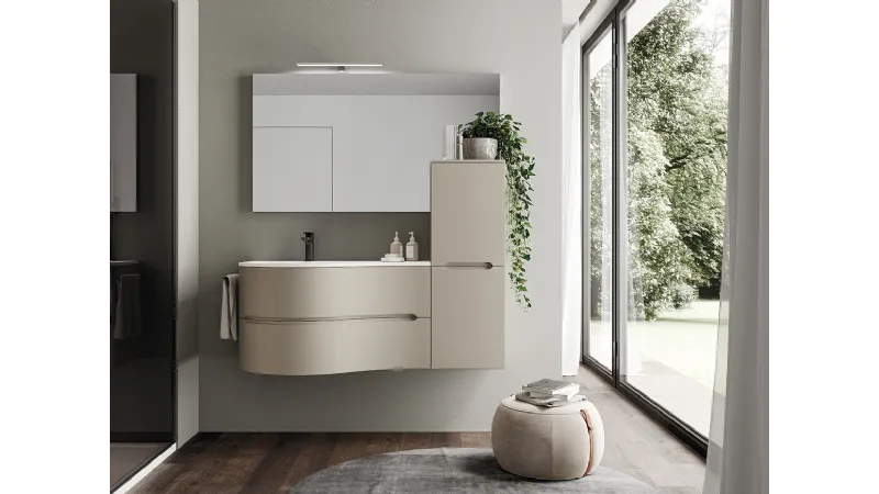 Le forme armoniose della base curva si abbinano all'essenzialità del pensile sospeso